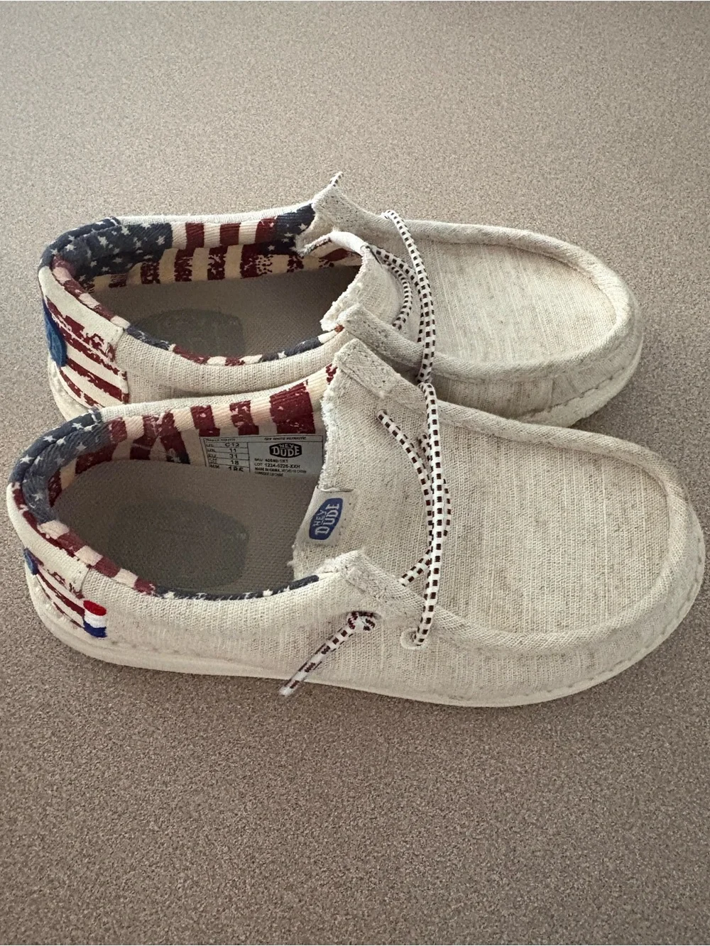 Hey Dude Kids Slip-On Sneakers in Natural with Red & Blue Flag Lining